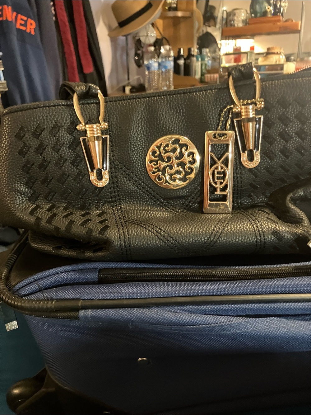 Taizhou embroidered black leather purse with gold hardware